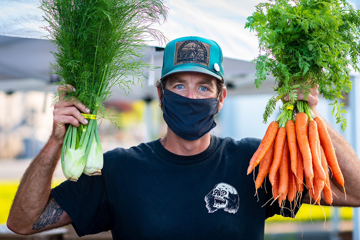 Justin Moore in mask with carrots and fennel